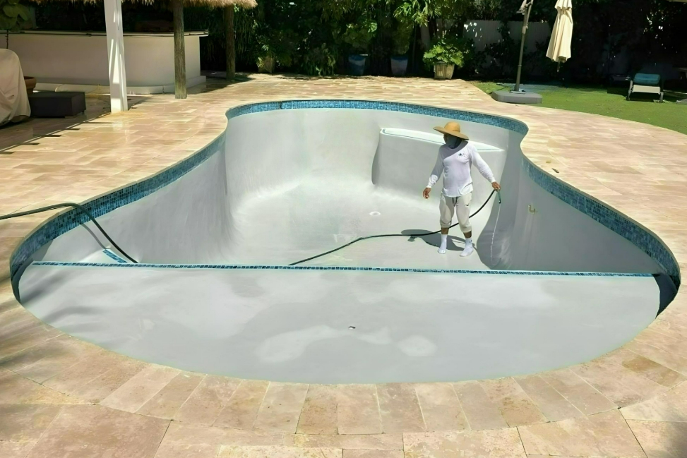 guy-standing-in-empty-pool-resurfacing-kendall-fl