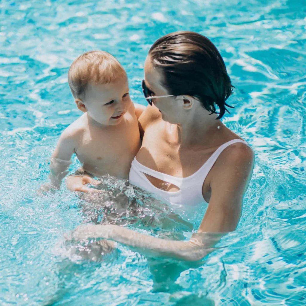 young-mother-with-little-kid-in-swimming-pool